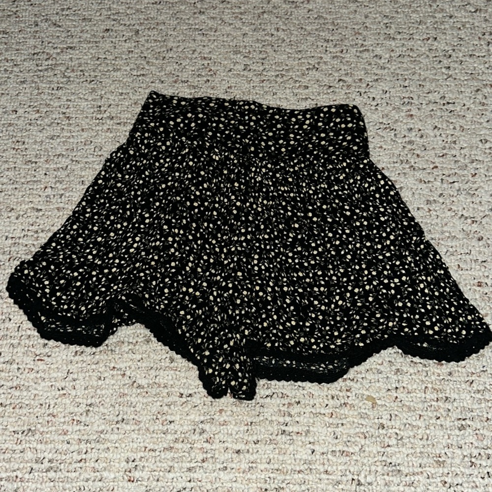Black shorts with yellow and white flowers, size small